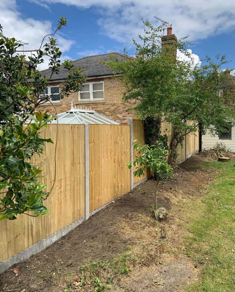 This is a photo of fence panels installed in a residential garden using concrete posts and gravel boards. Installed by Fast Fix Fencing Gravesend