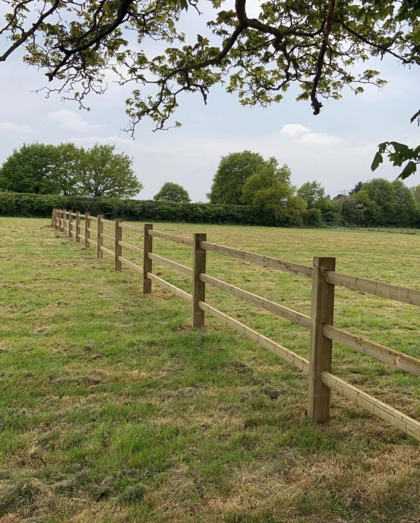 This is a photo of a post and rail fence installed in a field by Fast Fix Fencing Gravesend